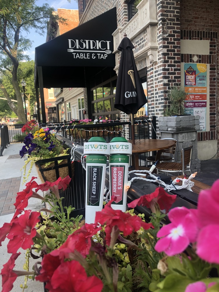 Patio Seating with Beer and Red Flowers